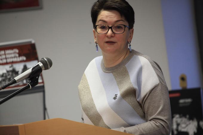 Director of the State Archives of Minsk Region, Yulia Romashko, speaking